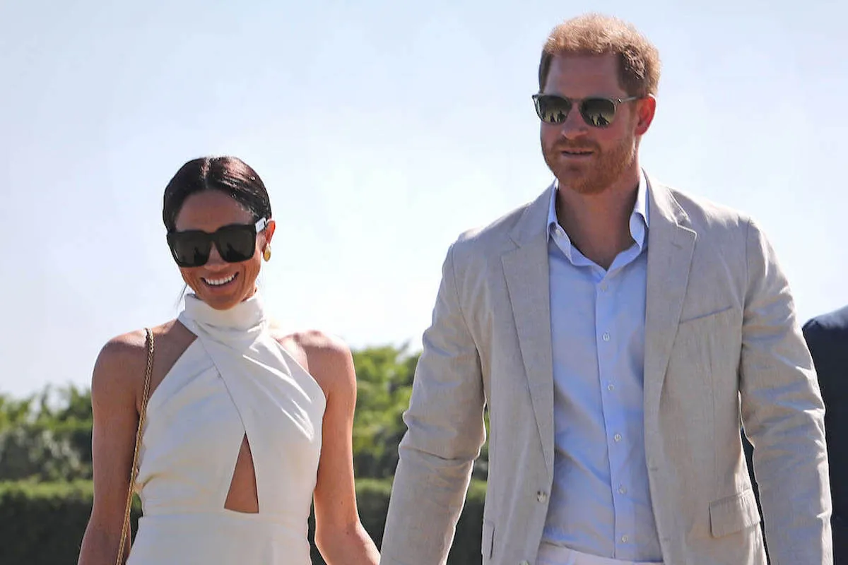 Meghan Markle, who has an uncoming Netflix show about cooking and gardening, with Prince Harry at a charity polo match