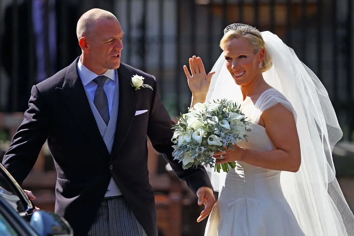 Mike Tindall and Zara depart after their Royal wedding at Canongate Kirk in Edinburgh, Scotland