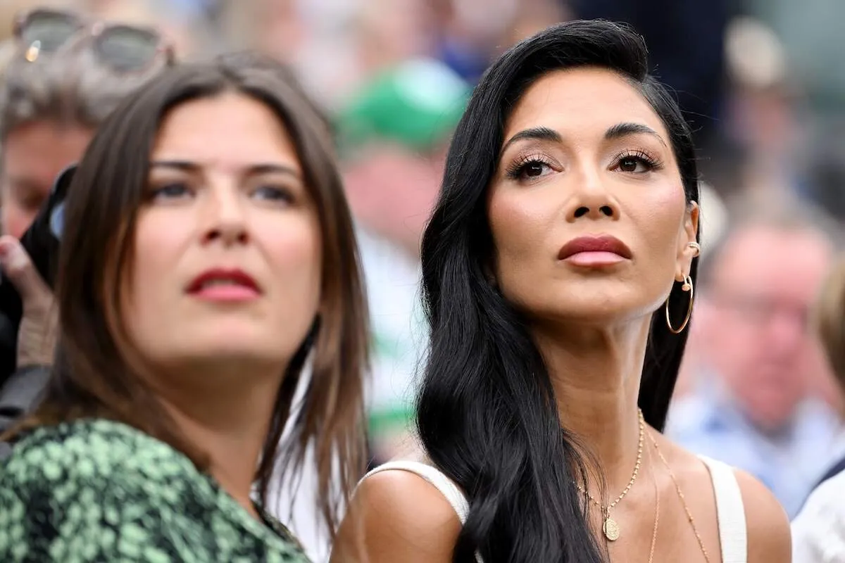 Wearing a cream dress and gold jewelry, Nicole Scherzinger sits front row at Wimbledon 2024