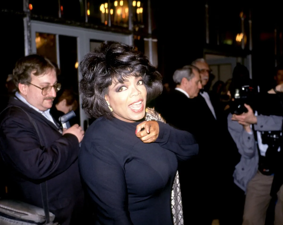 American talk show host Oprah Winfrey wears a black dress at an awards show in 1992