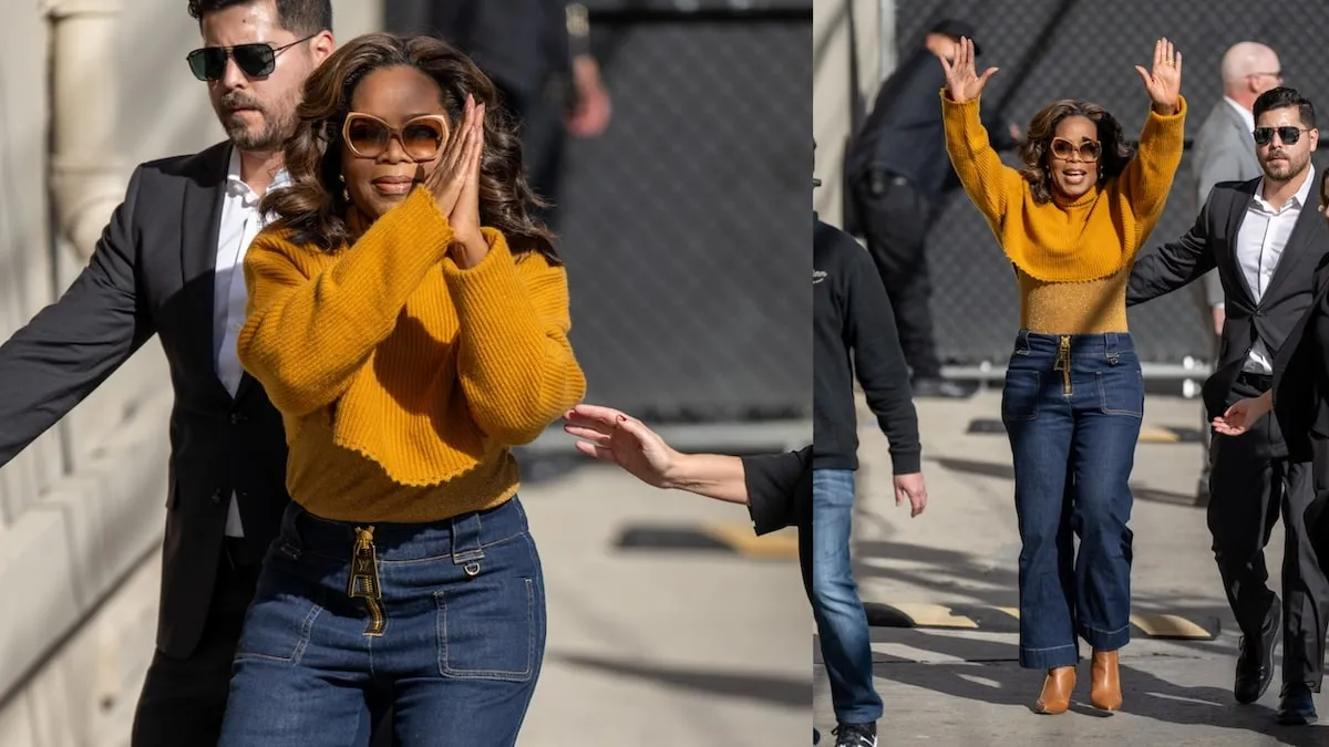 Wearing a mustard colored sweater, Oprah Winfrey waves to fans before entering 'Jimmy Kimmel Live' studios