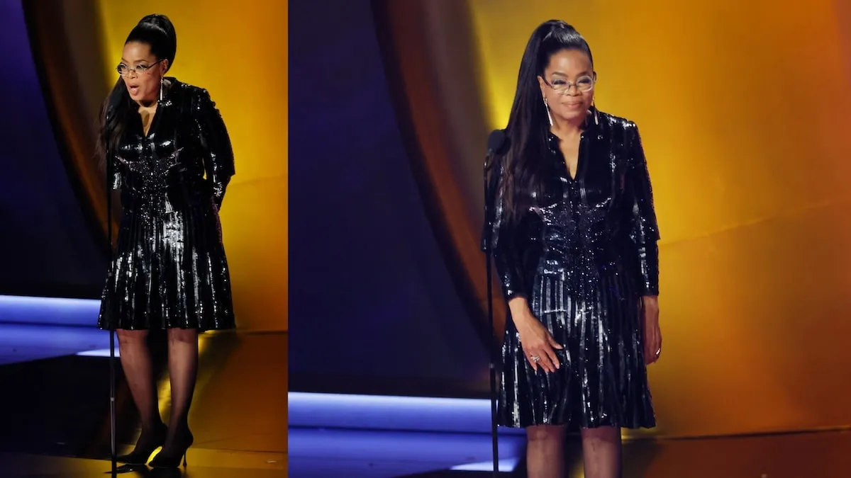 Wearing a black mini-dress, Oprah Winfrey walks onstage at the 66th Grammy Awards