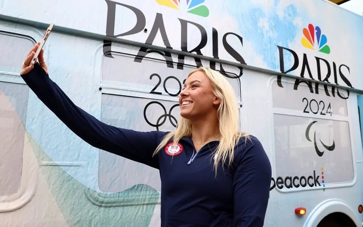 Paralympian Jessica Long takes a selfie during the Team USA Road to Paris Bus Tour