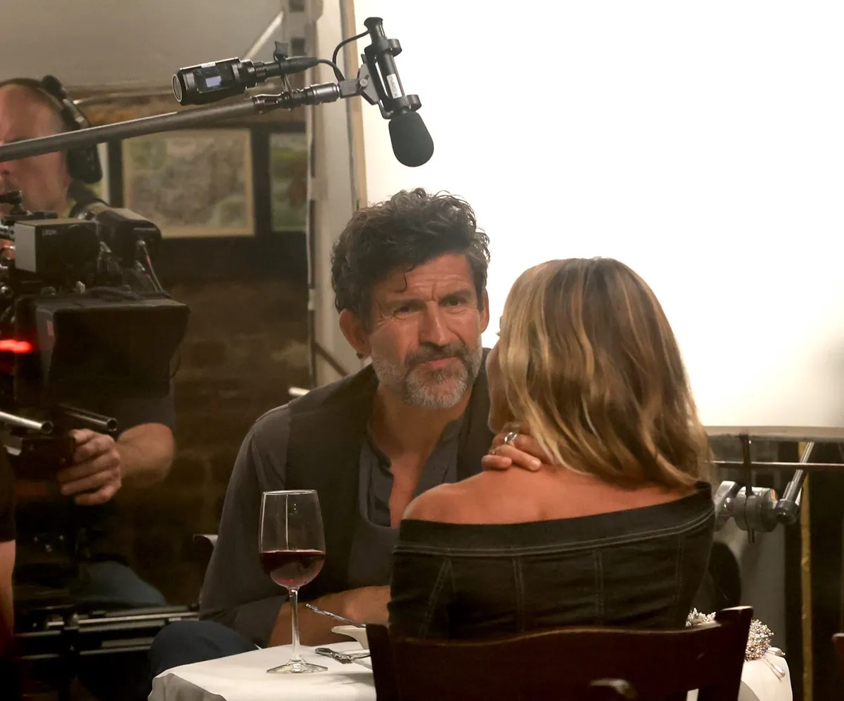 Sarah Jessica Parker and Jonathan Cake film a scene in a restuarant for 'And Just Like That...' season 3