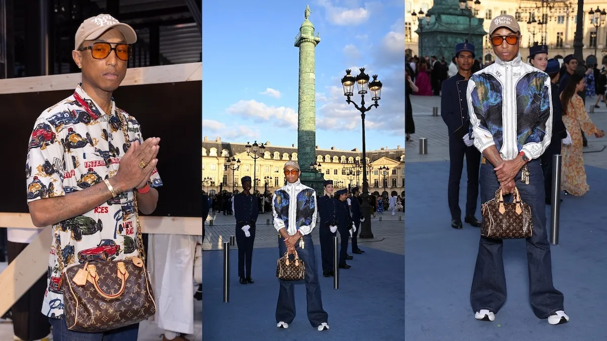 Rapper Pharrell Williams holds his Louis Vuitton bag in Paris