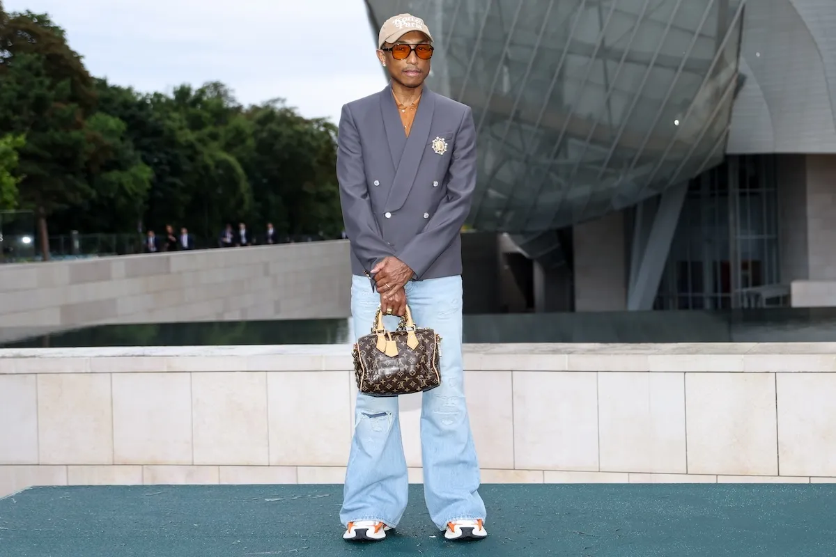 Rapper Pharrell Williams carries a Louis Vuitton bag at The Prelude To The Olympics