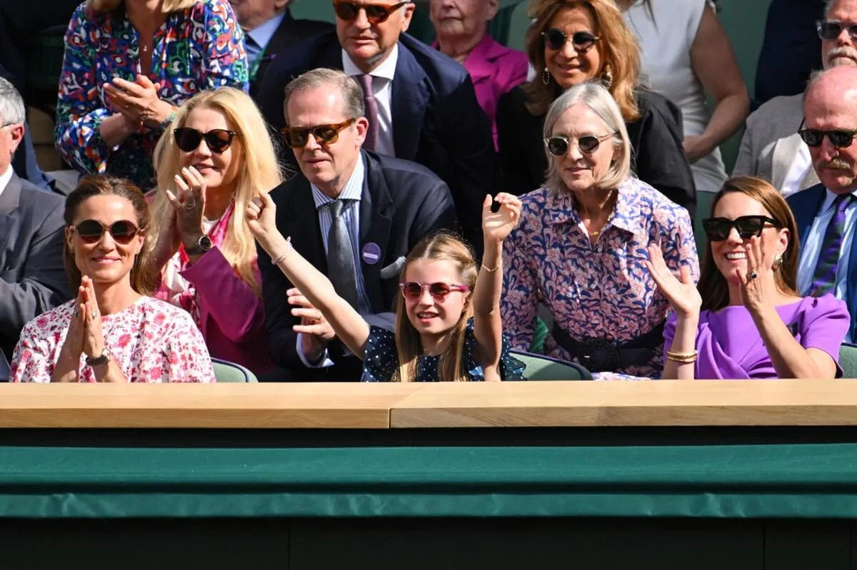 Pippa Middleton, Princess Charlotte, and Kate Middleton sitting at Centre Court during the men's final of the Wimbledon Tennis Championships