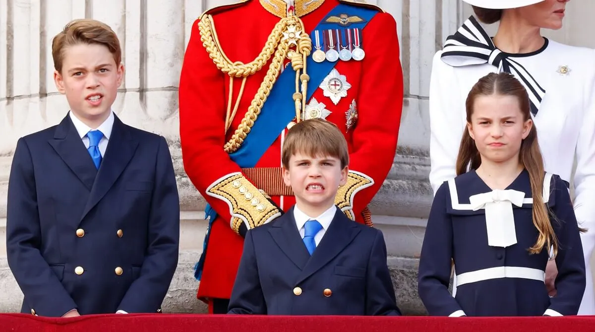 Prince George, Prince Louis, and Princess Charlotte watch a flypast from the balcony of Buckingham Palace after Trooping the Colour