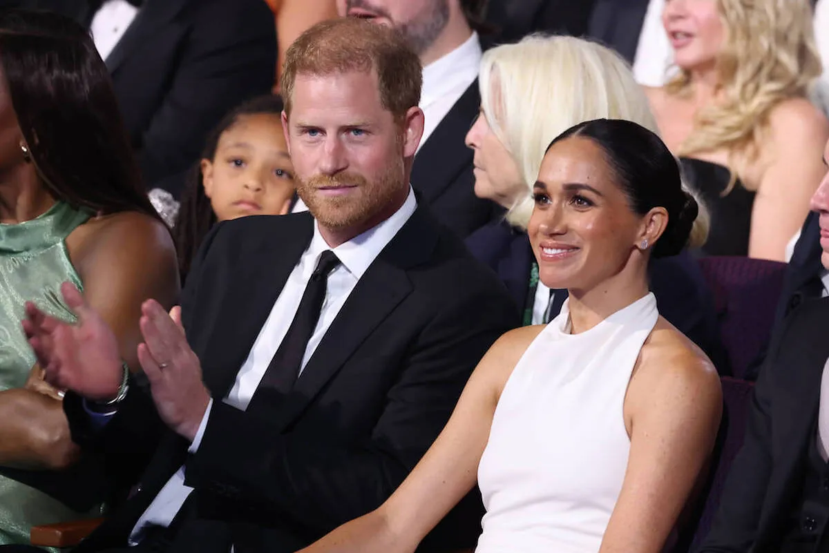 Prince Harry and Meghan Markle sit in the their seats at the 2024 ESPYs