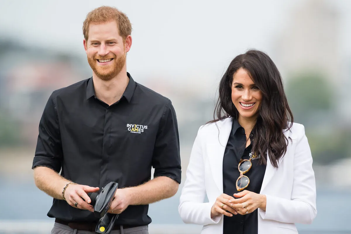 Prince Harry and Meghan Markle smile at the Invictus Games, which will be held in Birmingham, England, in 2027.