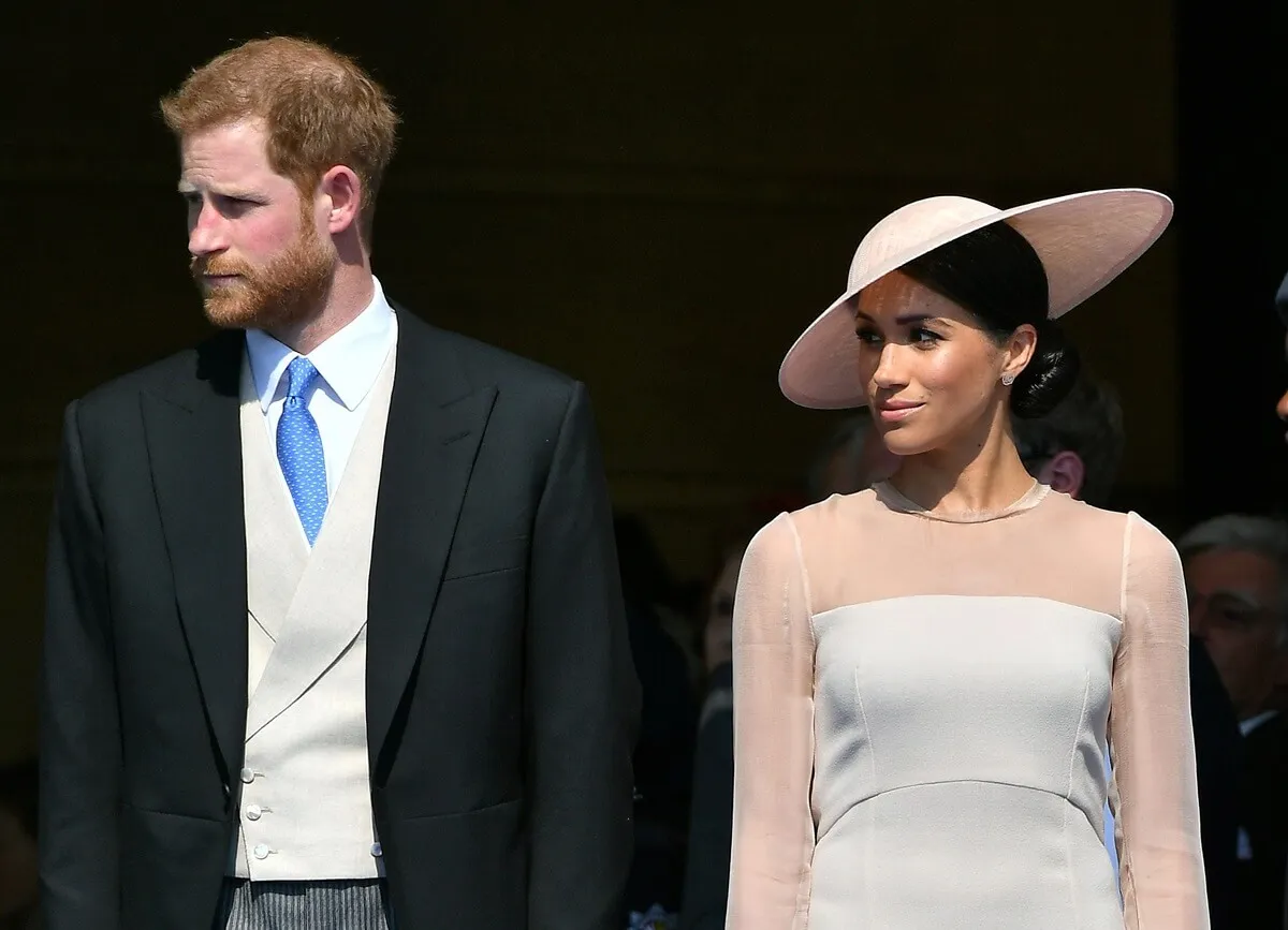 Prince Harry and Meghan Markle attend then-Prince Charles' 70th Birthday Garden Party at Buckingham Palace