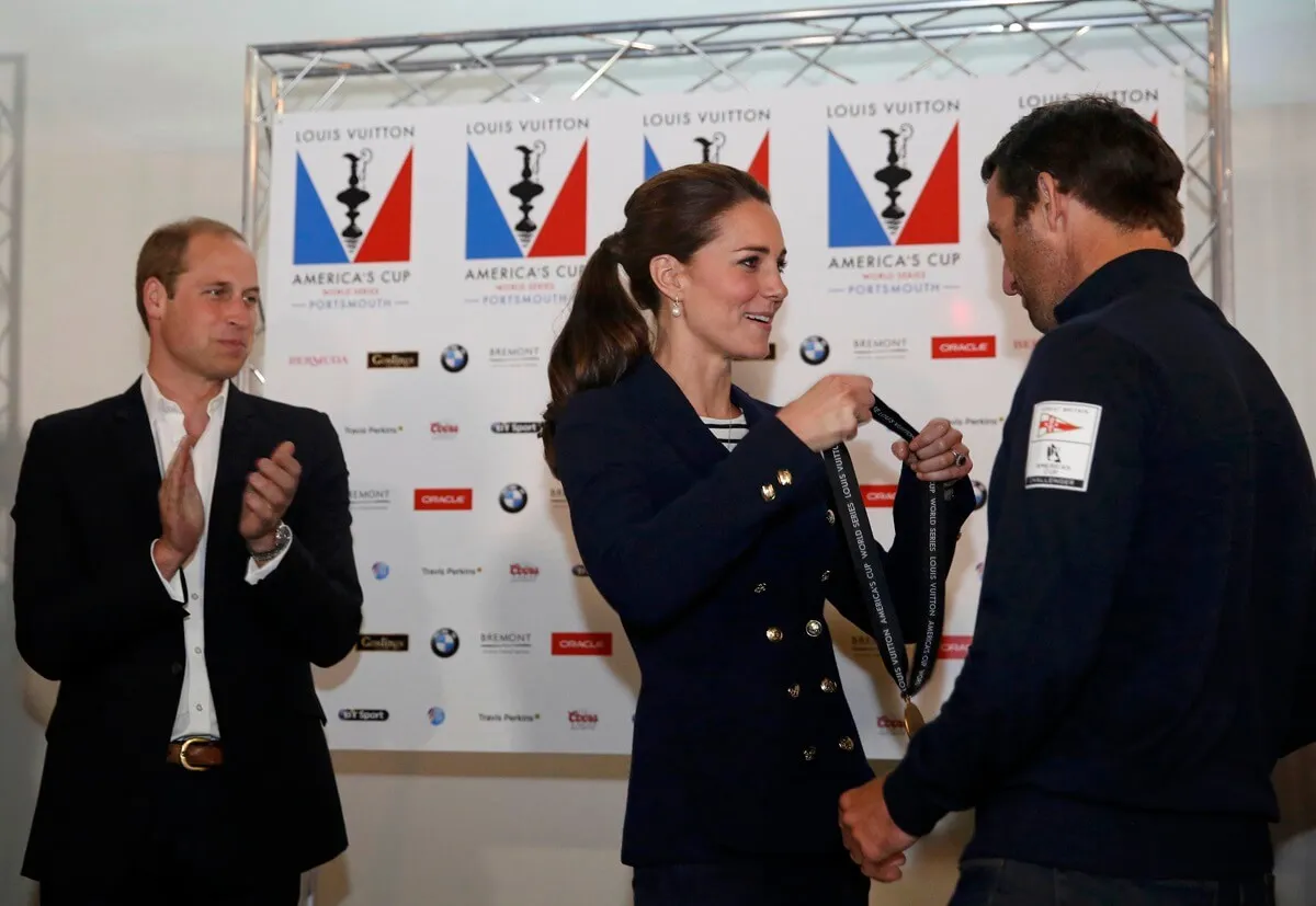 Prince William applauds as Kate Middleton presents a medal to Sir Ben Ainslie