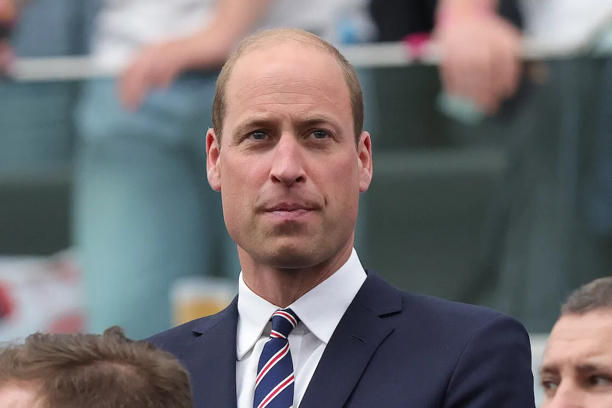 Prince William, who went into 'dad' mode while filming a YouTube video, in 2024 wearing a suit and looking on