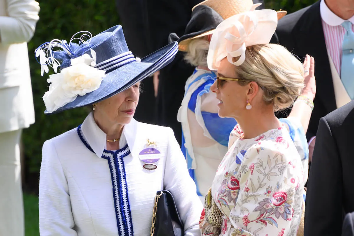 Princess Anne, whose hospitalization has 'shaken' daughter Zara Tindall, stands with Zara Tindall