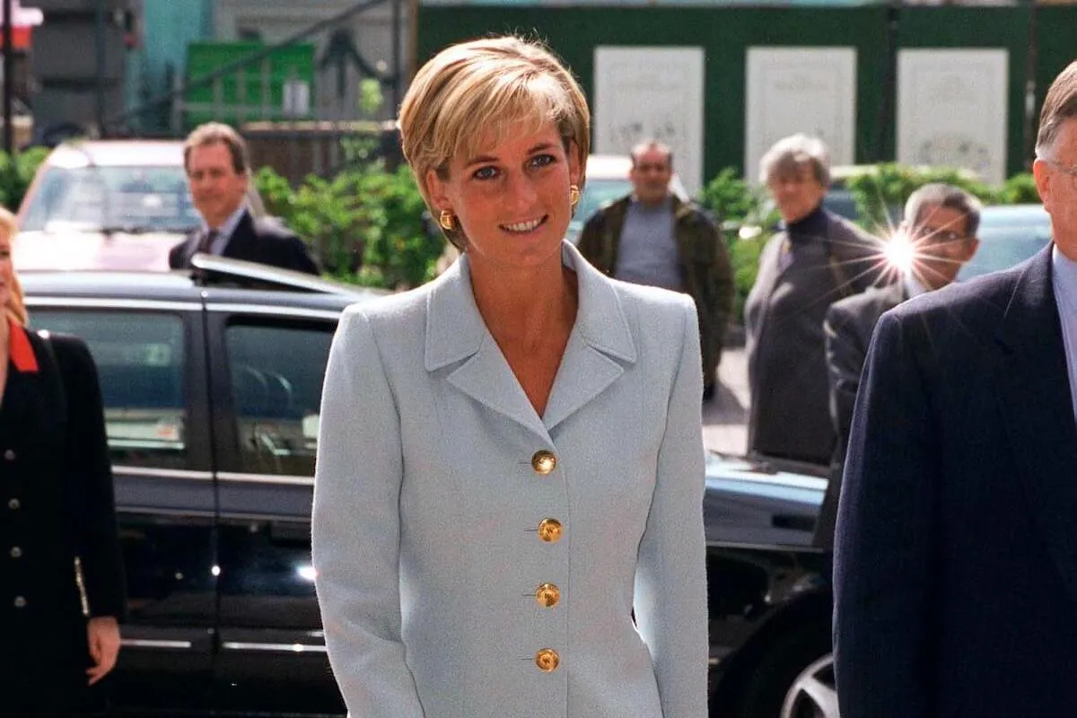 Princess Diana, whose looks John F. Kennedy Jr. commented on following a secret meeting, in a blue suit