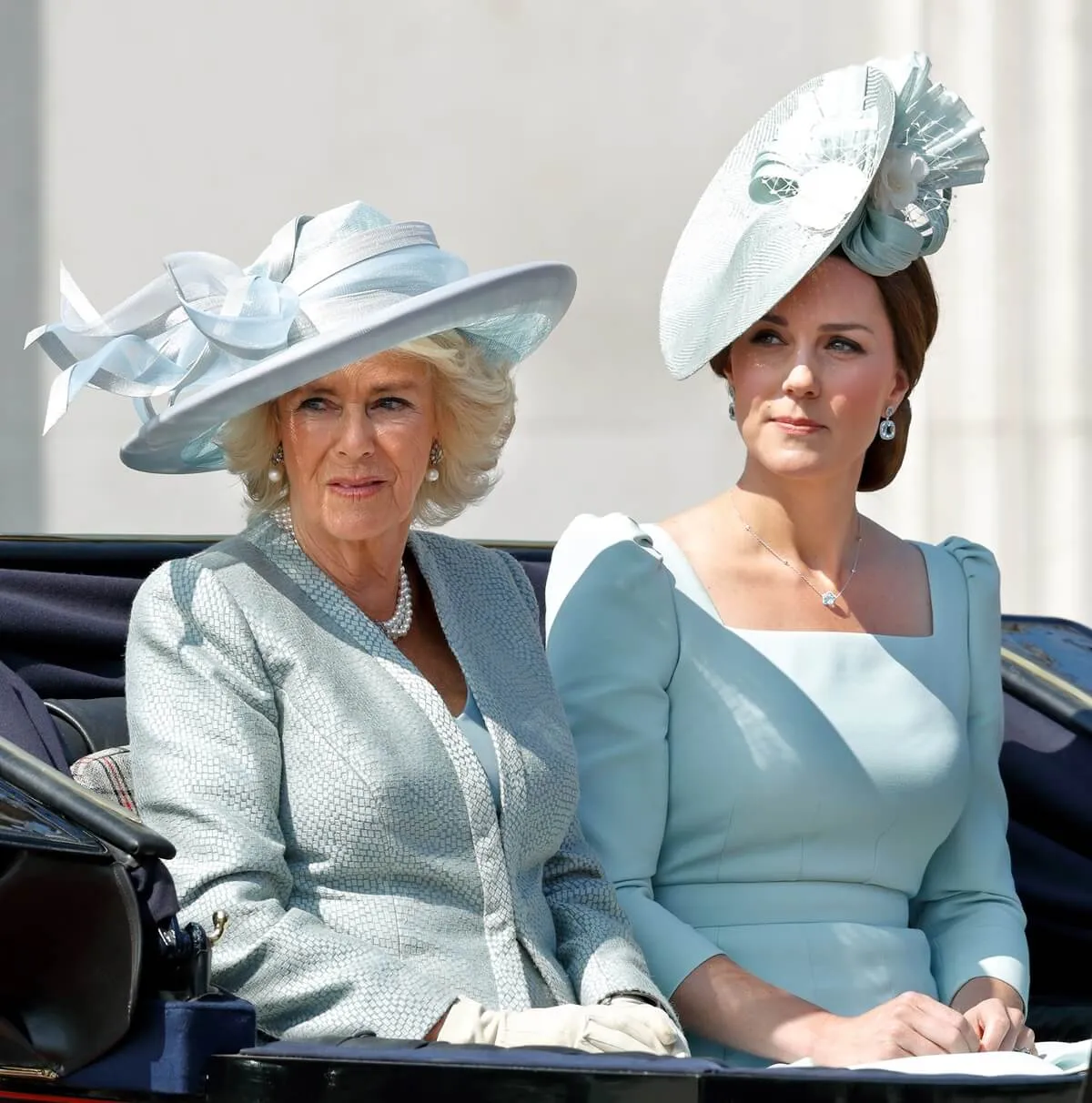 Queen Camilla and Kate Middleton travel down The Mall in a horse drawn carriage during Trooping The Colour