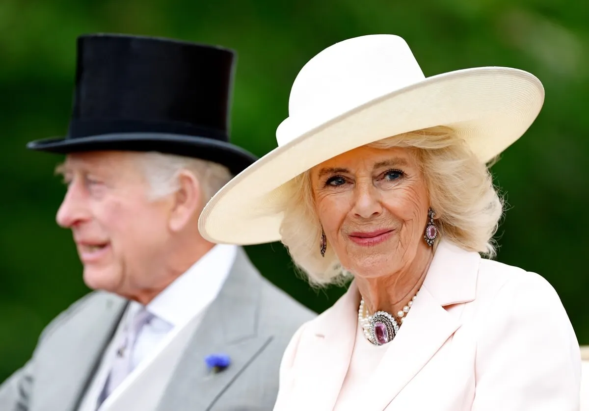 Queen Camilla, wearing her pink topaz demi-parure necklace and earrings, attends Royal Ascot 2024 with King Charles III