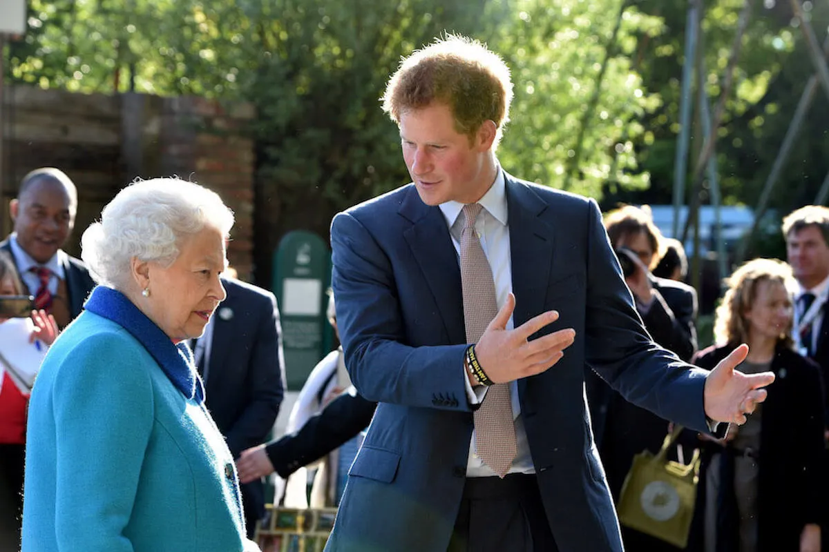 Prince Harry, who didn't want Prince Archie to learn how to do the queen wave from Queen Elizabeth II, with the late sovereign in 2015.