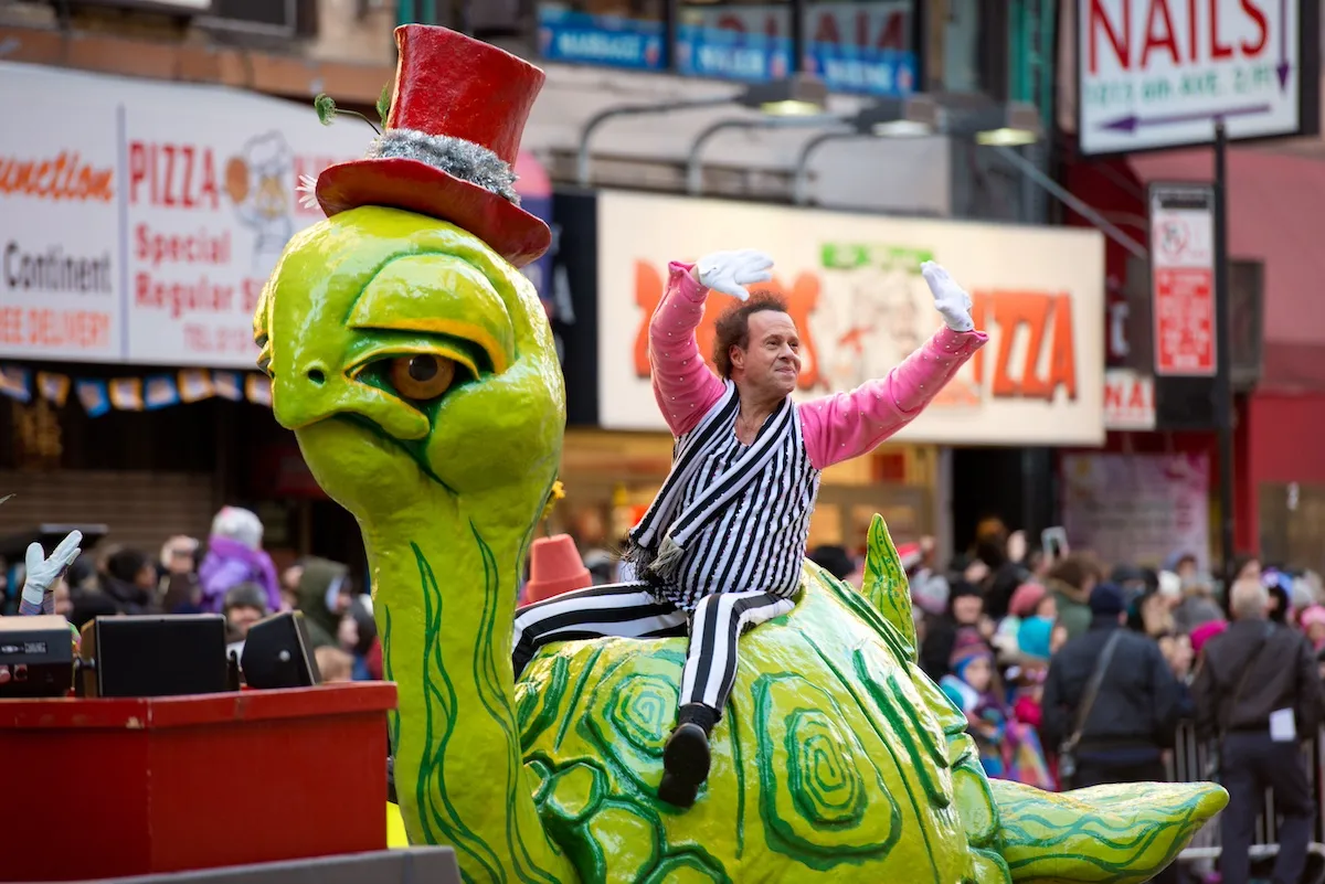 Richard Simmons riding on a float at the Macy's Thanksgiving Day Parade