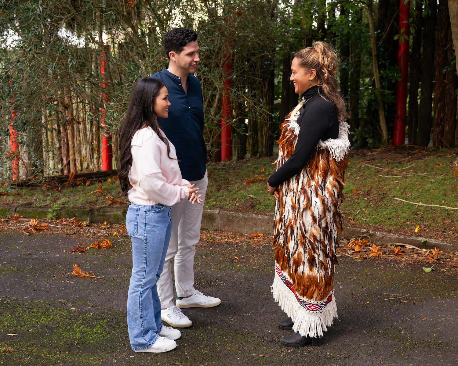 Devin Strader and Jenn Trans standing next to each other and in front of an indigenous person on their one-on-one date in 'The Bachelorette' Season 21 Episode 4