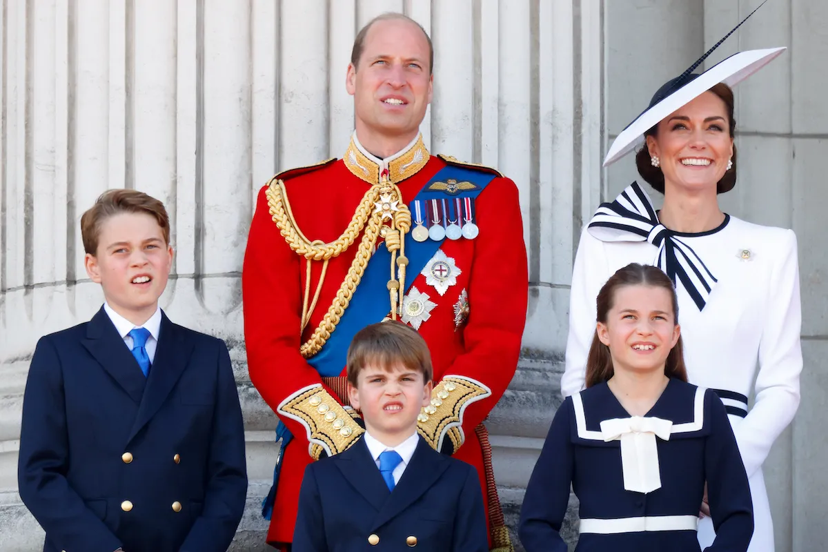 Prince William and Kate Middleton, who made an 'unusual and enlightened' decision about royal parenting, with their children on the Buckingham Palace balcony.