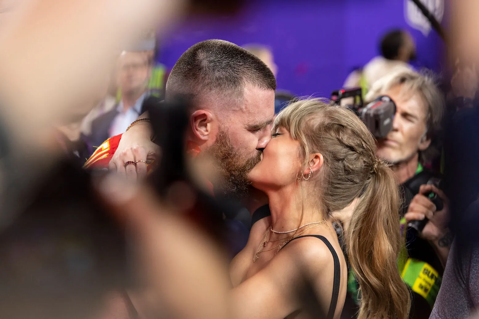 Travis Kelce and Taylor Swift kissing after the Super Bowl in 2024