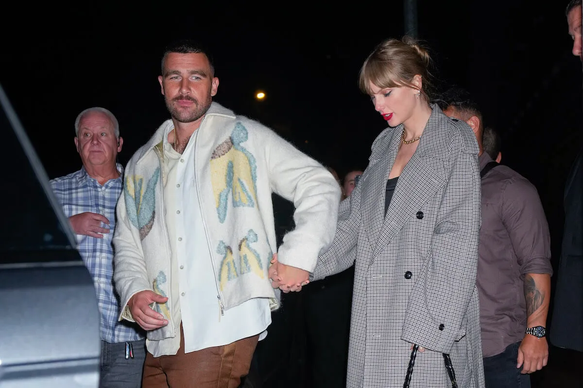 Travis Kelce and Taylor Swift hold hands