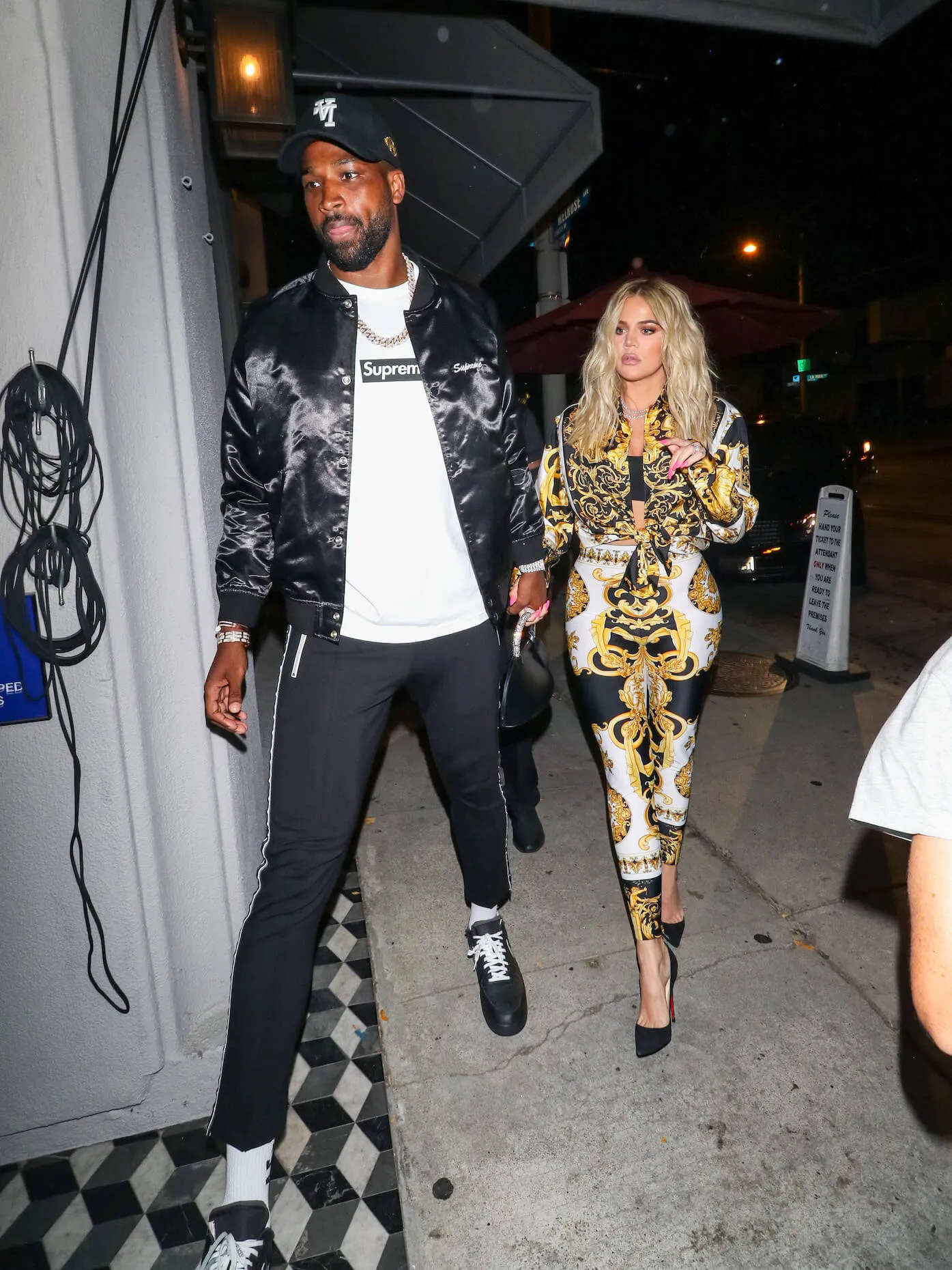 Tristan Thompson and Khloé Kardashian walking hand in hand in Los Angeles, California, in 2018