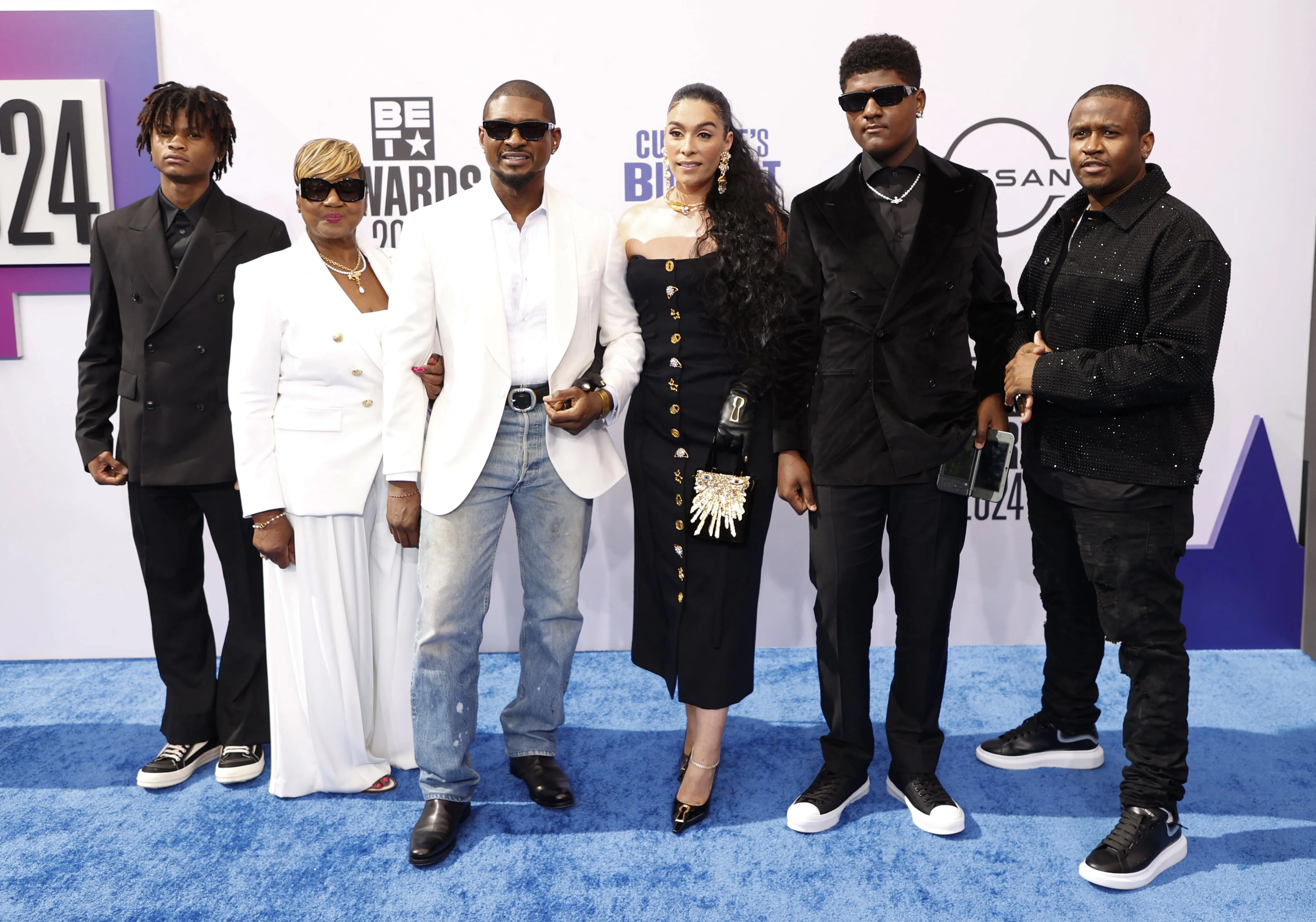 Usher, his wife Jennifer, three sons, and mom stand on the red carpet together before the 2024 BET Awards