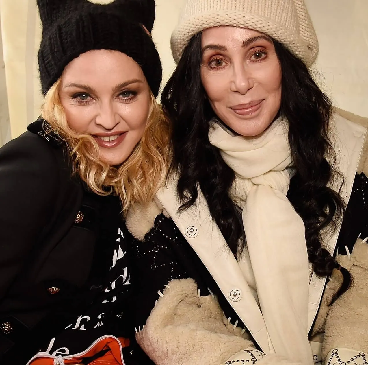 Madonna sitting next to Cher