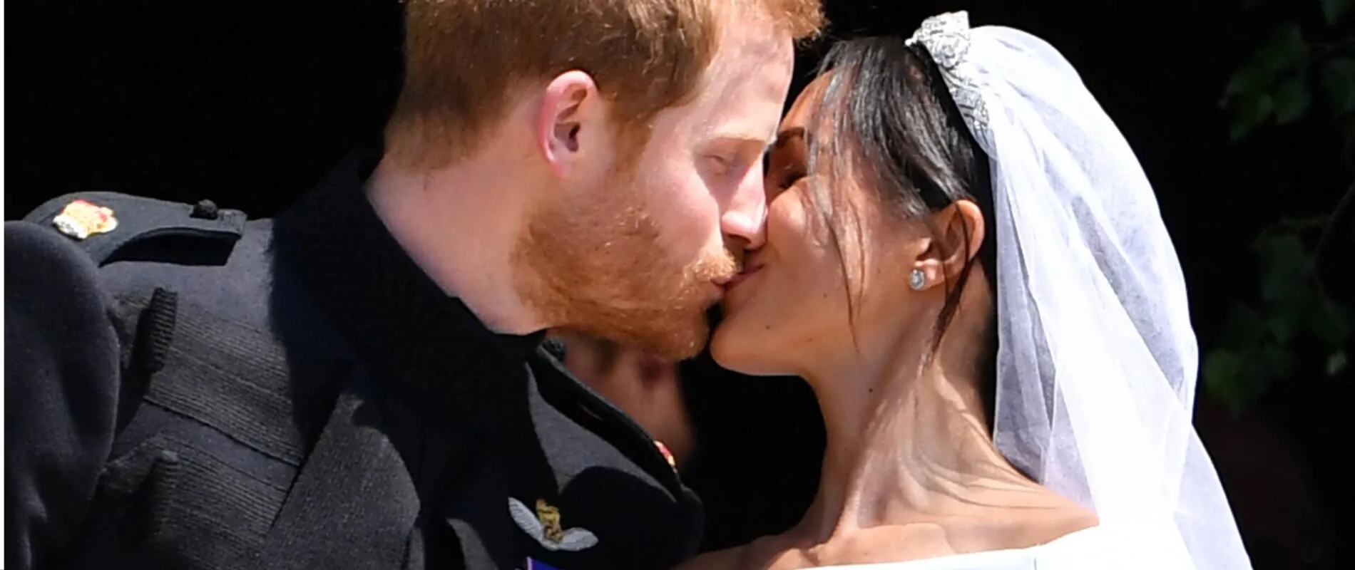 Prince Harry and Meghan Markle kiss on the steps of St. George's Chapel in Windsor