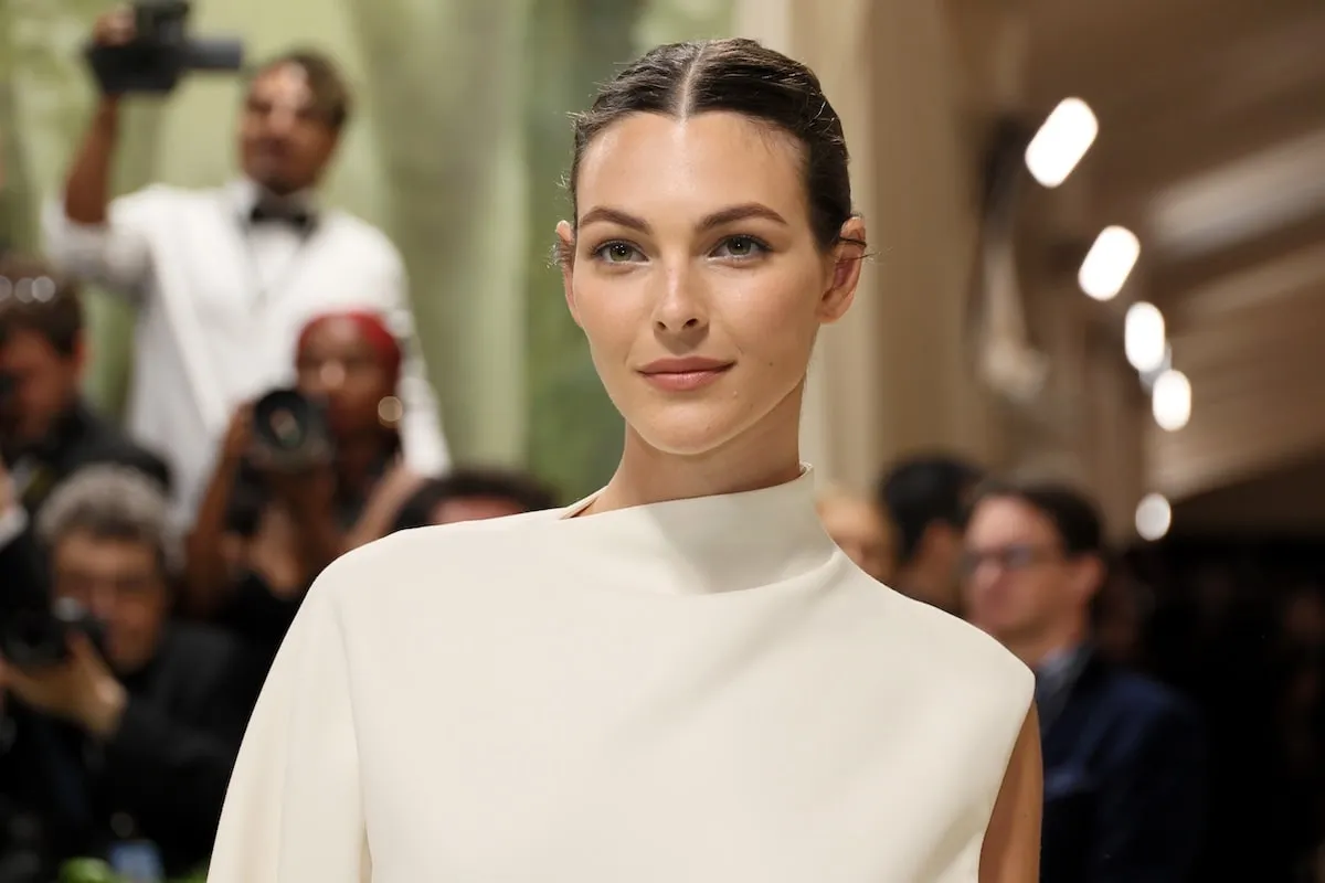 Wearing a white gown, Vittoria Ceretti poses on the Meta Gala red carpet