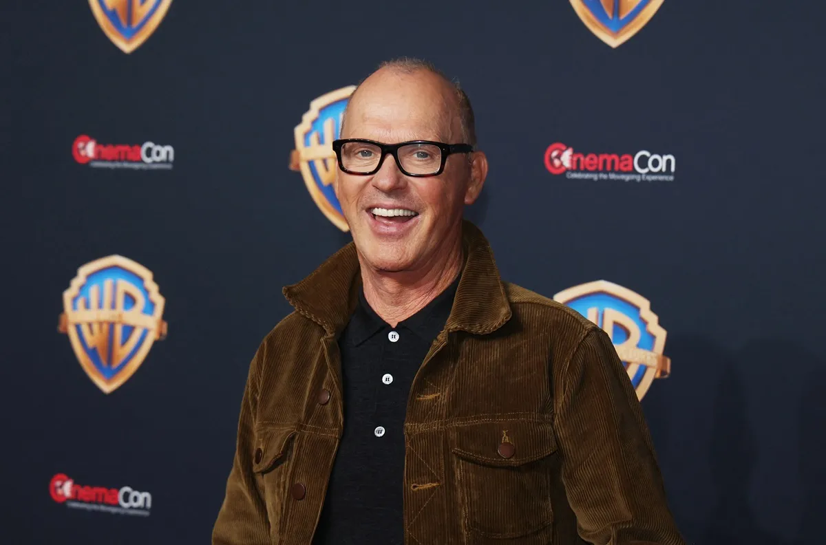 Michael Keaton posing at cinemacon.