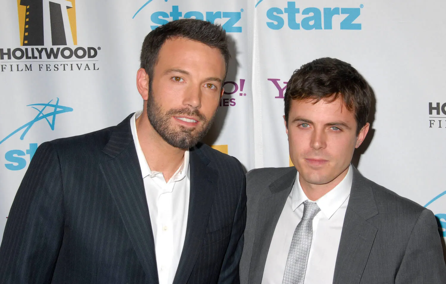 Ben Affleck and Casey Affleck posing together at Hollywood Film Festival's Hollywood Awards in 2007