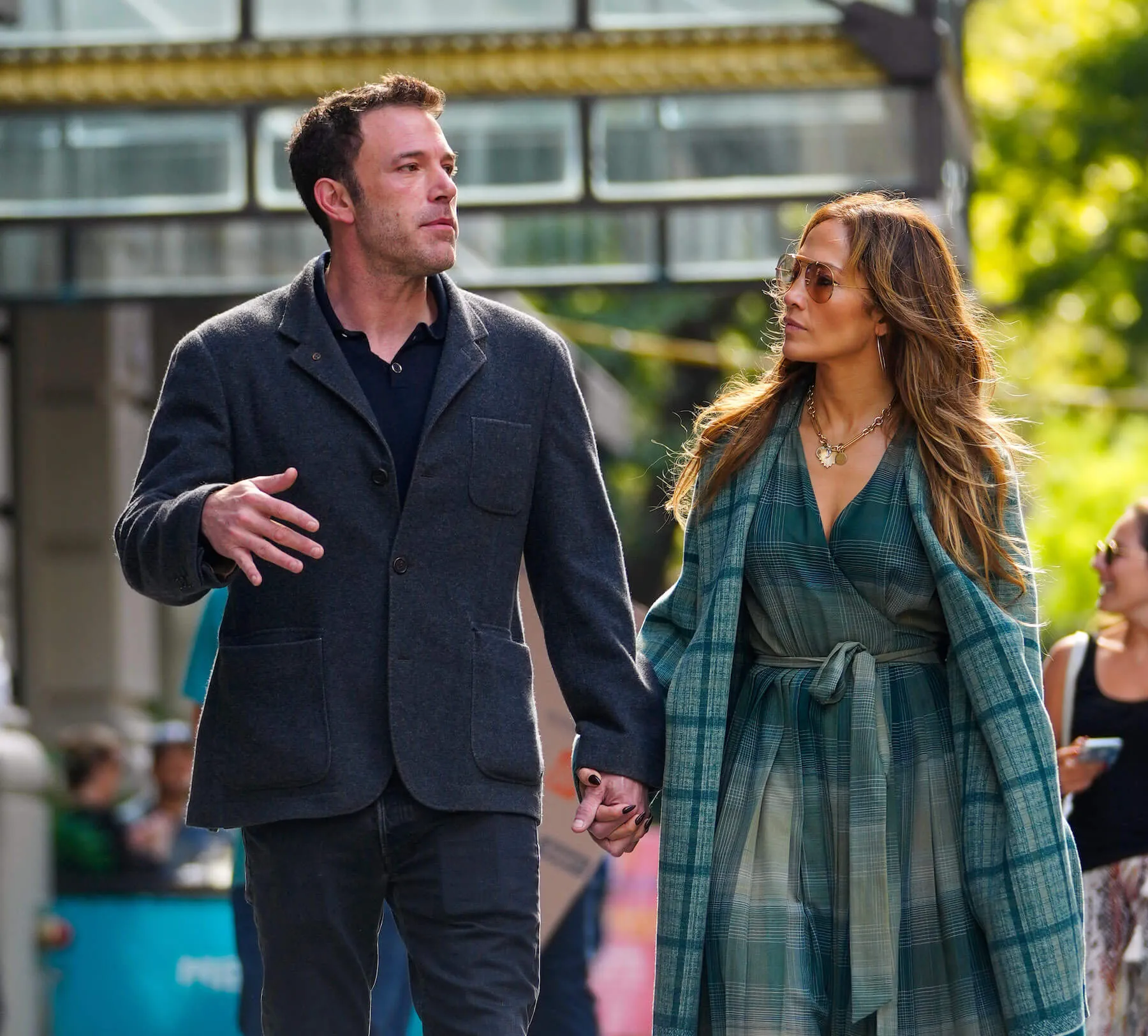 Ben Affleck and Jennifer Lopez holding hands and walking through New York City 