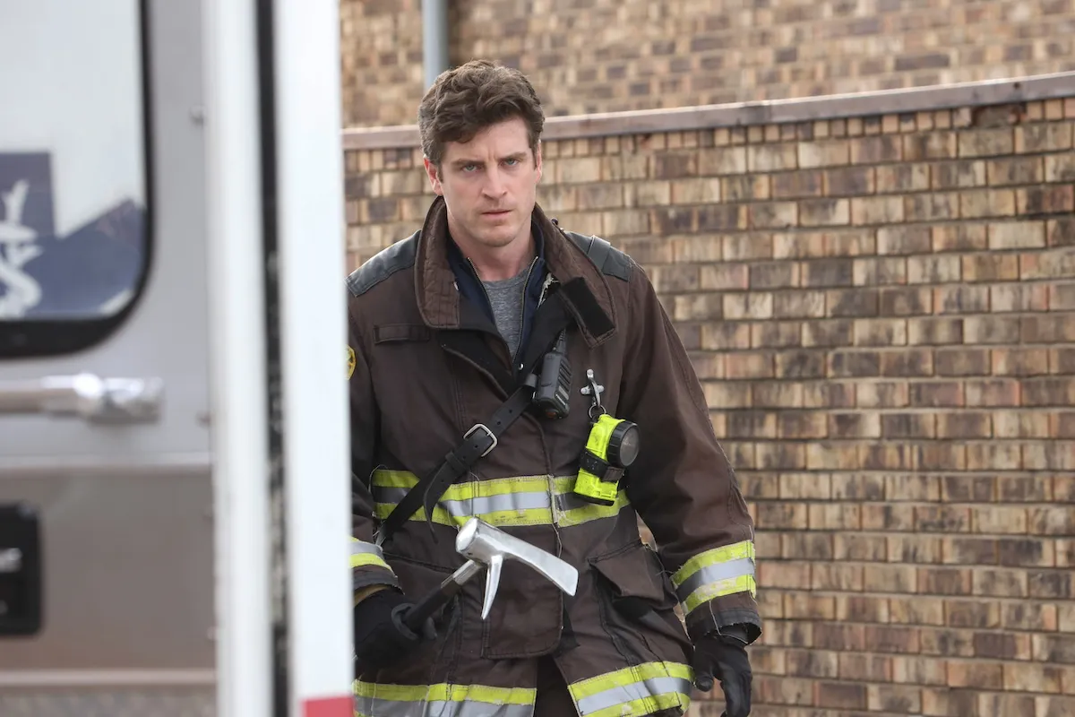 Jake Lockett as Sam Carver, wearing firefighting gear, in 'Chicago Fire' Season 12