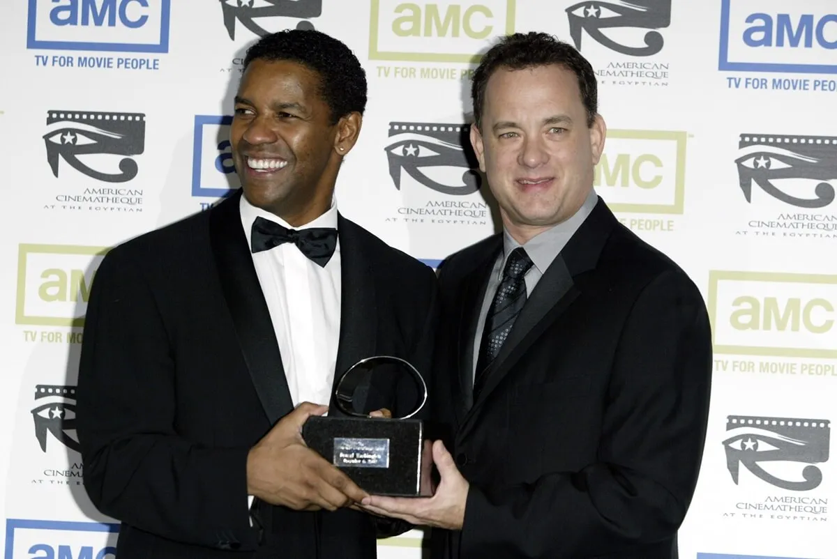 Denzel Washington and Tom Hanks posing in suits during The 17th Annual American Cinematheque Award Honoring Denzel Washington.