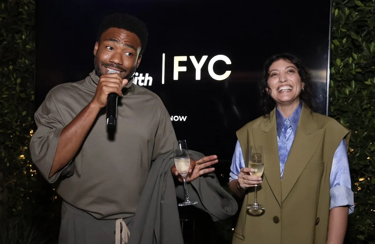 Actor Donald Glover speaks into a microphone at a special Amazon event for Mr. and Mrs. Smith