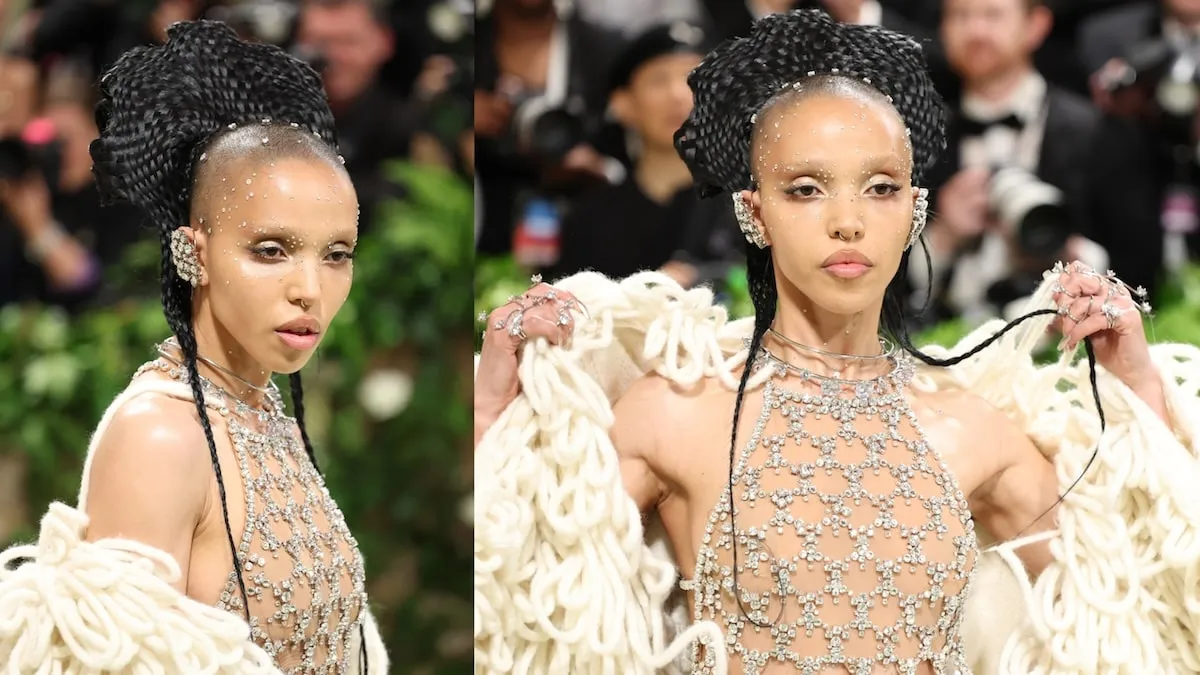 Singer FKA twigs wears a white bejeweled gown and her hair up in braids