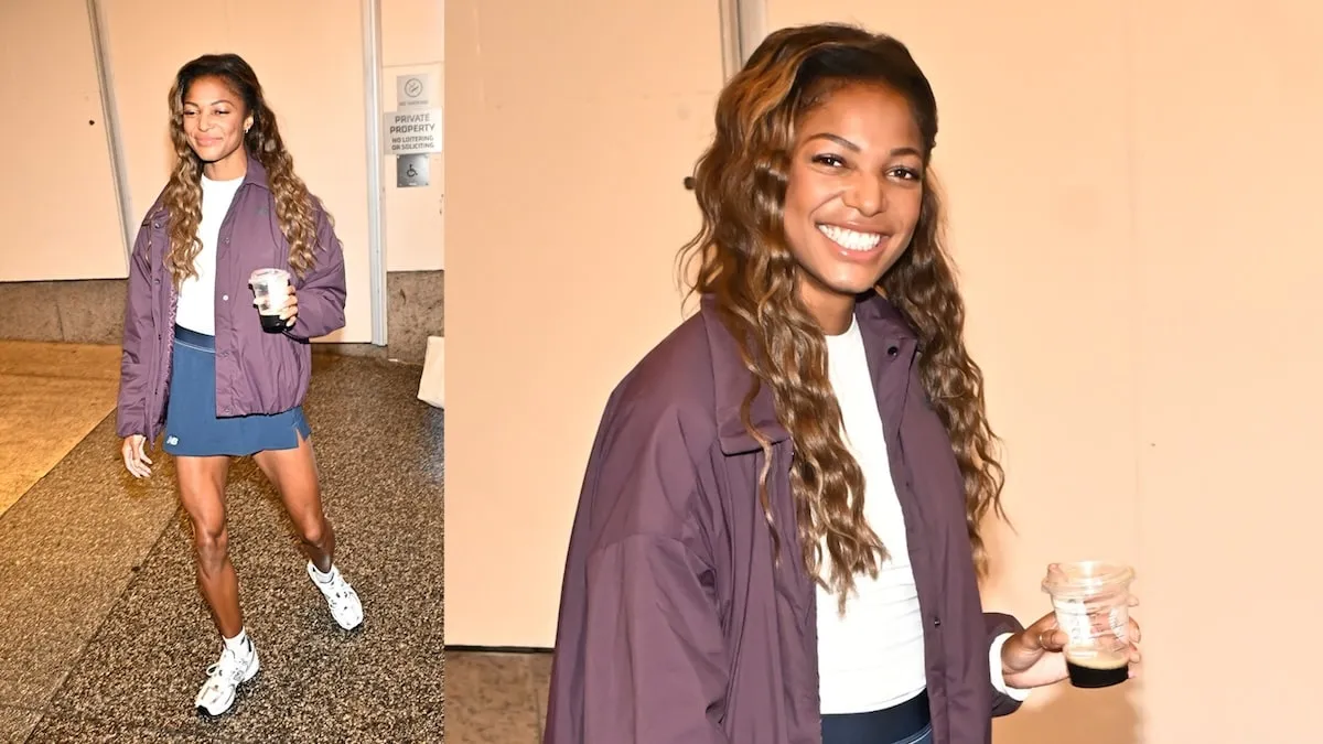 Wearing a purple jacket and navy shorts, Gabby Thomas exits CBS studios in NYC