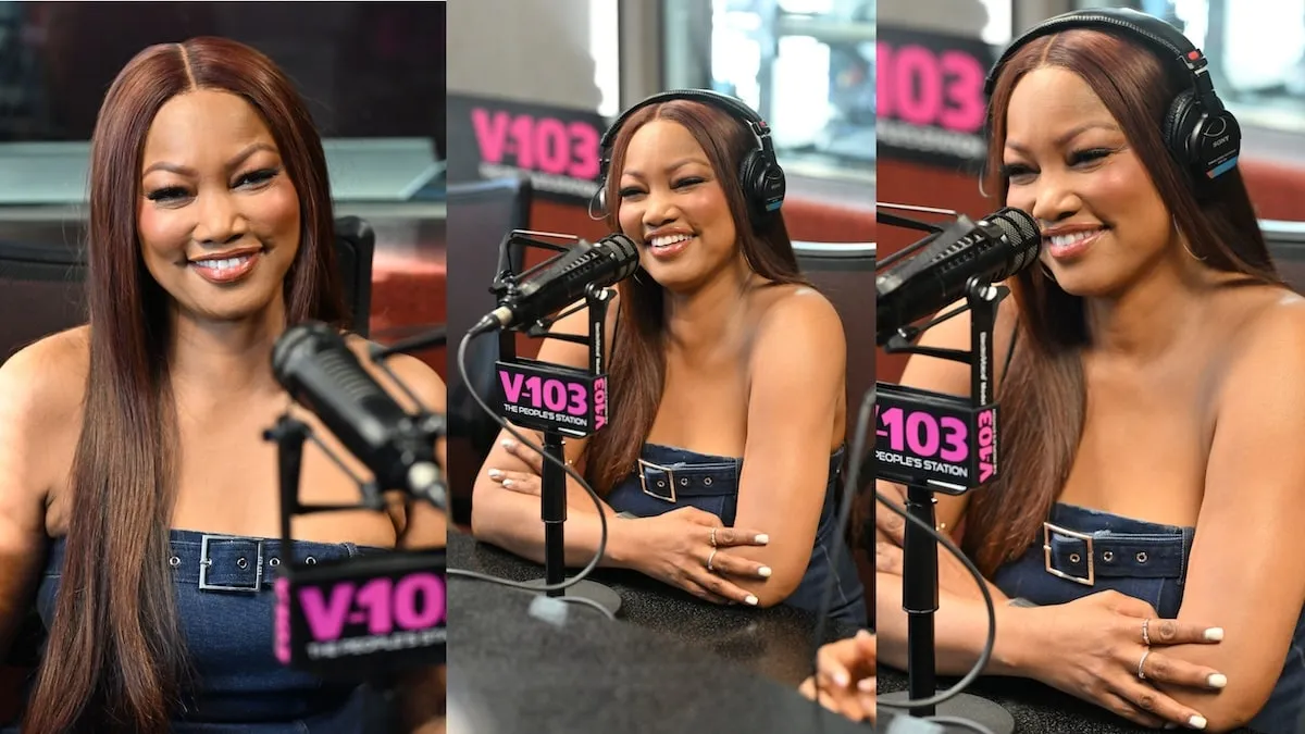 Wearing a denim dress, Garcelle Beauvais smiles while recording at "The Big Tigger Morning Show with Jazzy McBee"