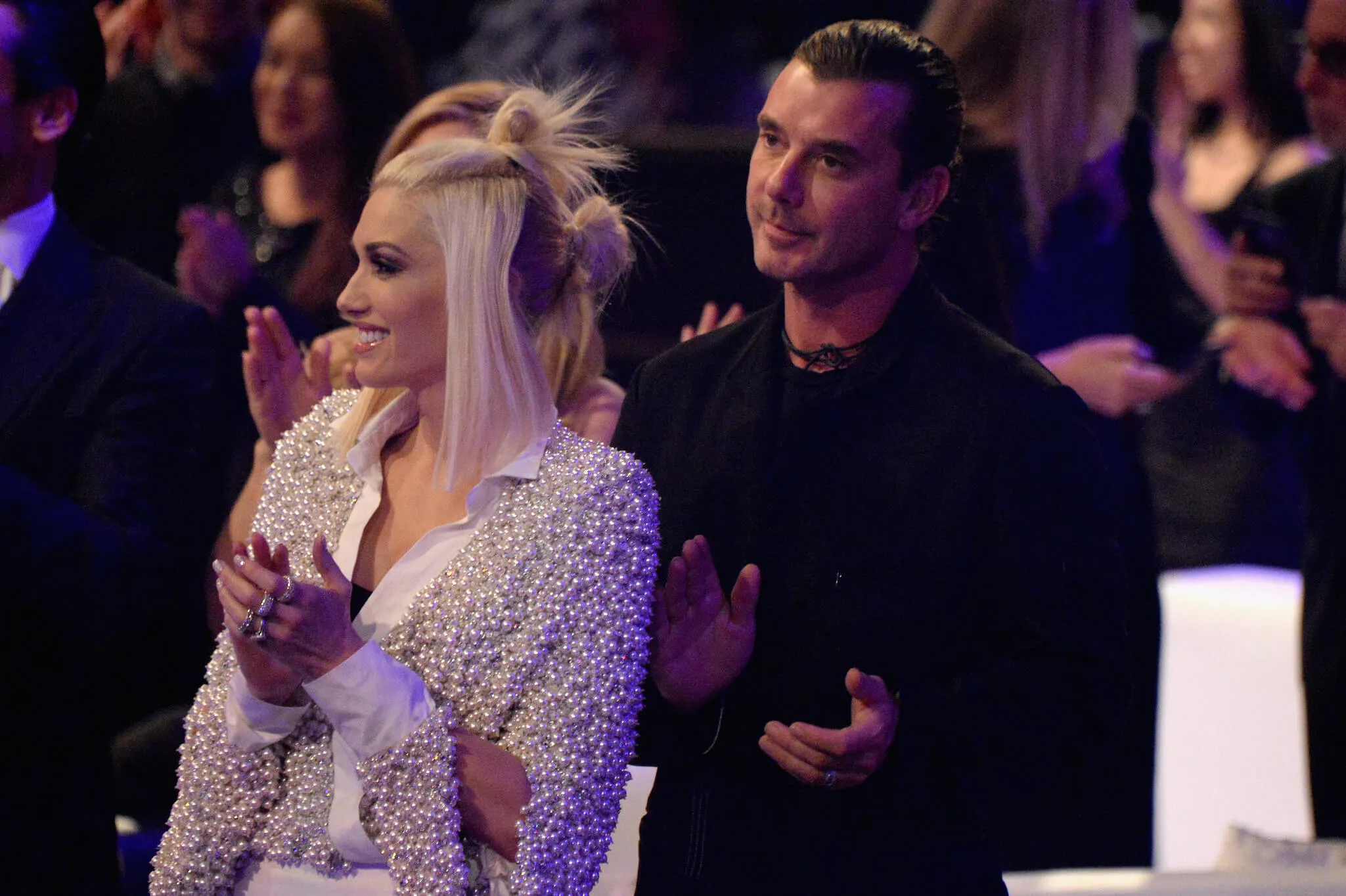 Gwen Stefani smiling and standing next to Gavin Rossdale at a People Magazine event in 2014