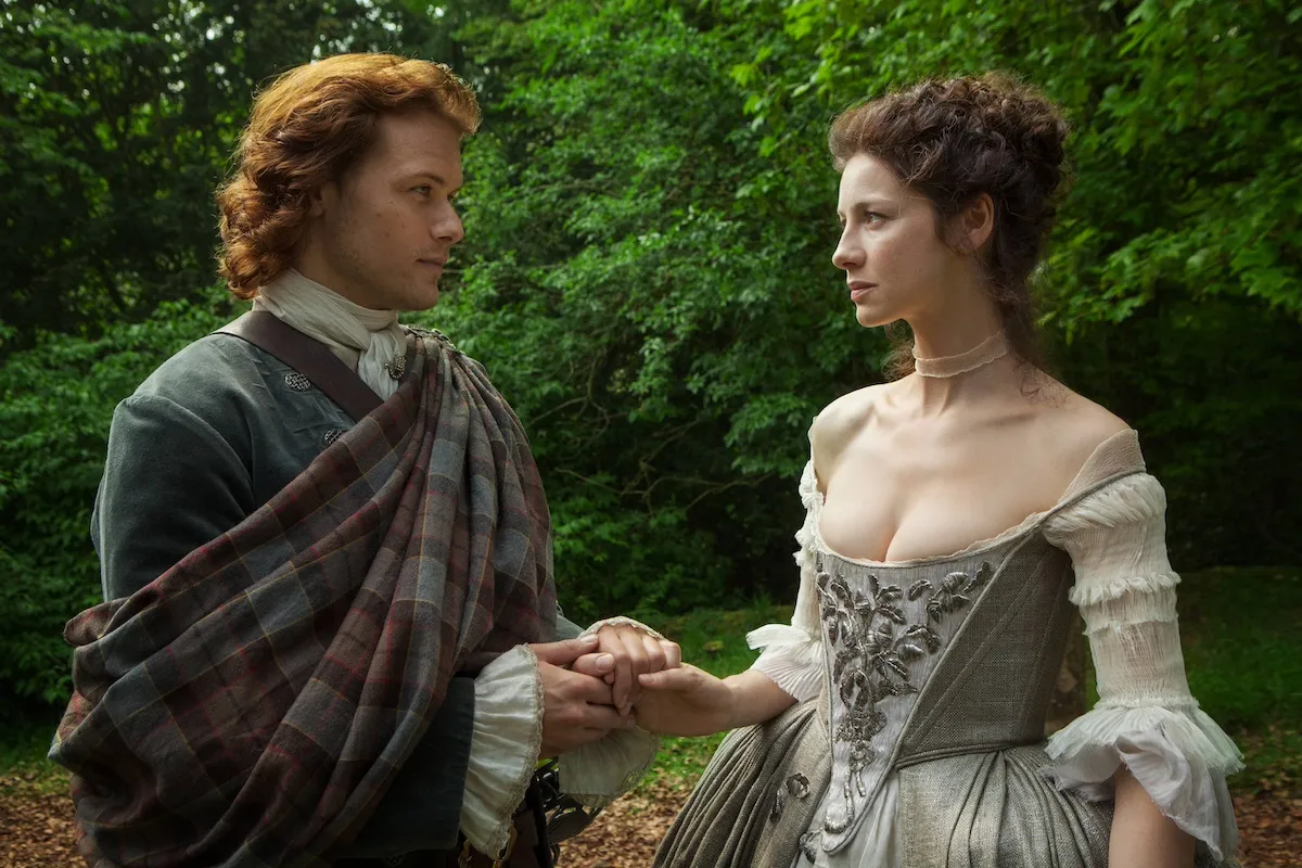 Jamie and Claire looking at each other on their wedding day in 'Outlander'