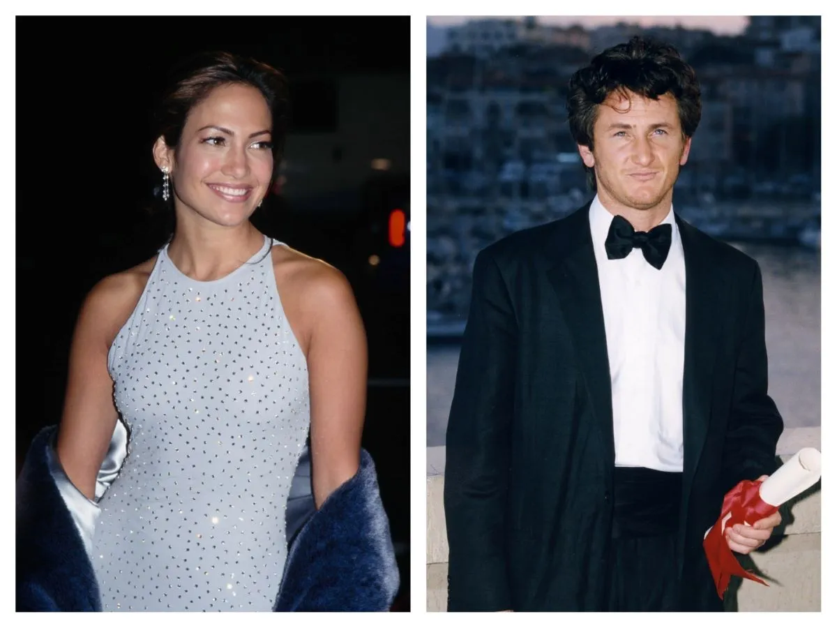 Jennifer Lopez wears a gray dress with rhinestones and holds a gray coat. Sean Penn wears a tuxedo and holds a rolled up paper tied with red ribbon.