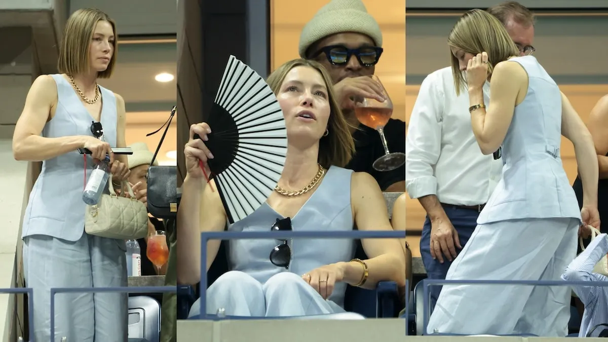 Wearing a light blue suit set, Jessica Biel watches the U.S. Open from her box seat