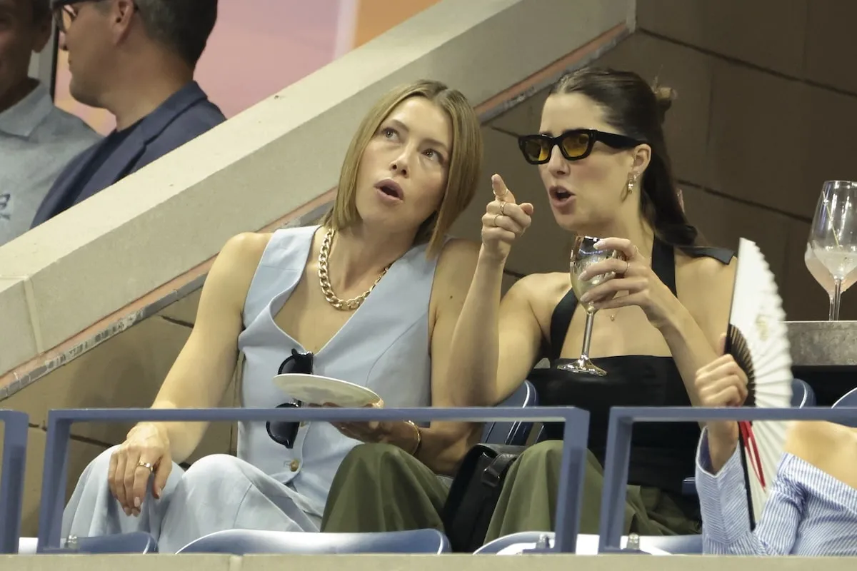 Wearing a light blue suit set, Jessica Biel and her friend watch the U.S. Open from her box seat