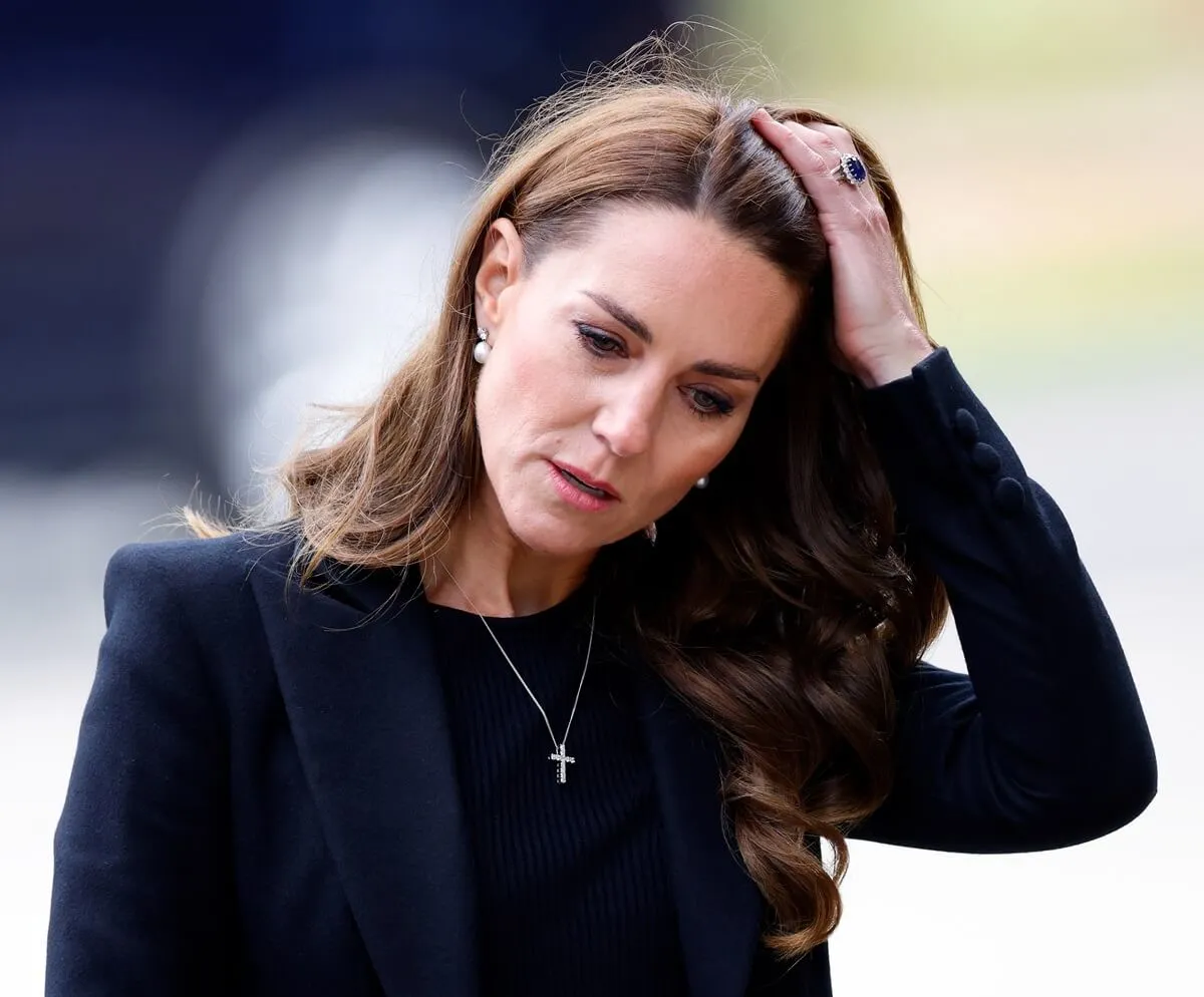 Kate Middleton views floral tributes to Queen Elizabeth II left at the entrance to Sandringham House