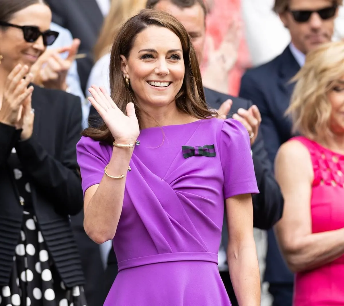 Kate Middleton waves to the crowd from the Royal Box before the start of the Mens Singles Final at The Wimbledon Lawn Tennis Championship