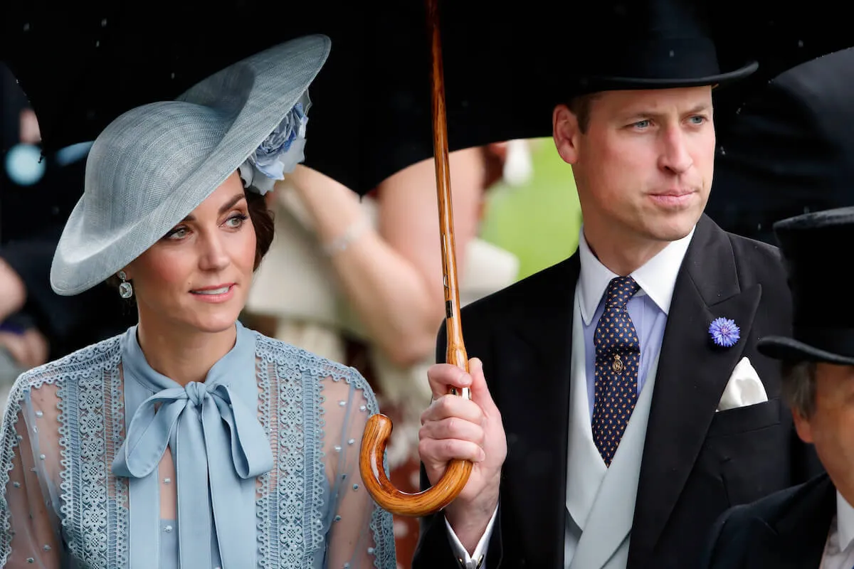 Kate Middleton, who started rethinking her and Prince William's entire relationship following their 2007 breakup, in 2019 standing under an umbrella together.