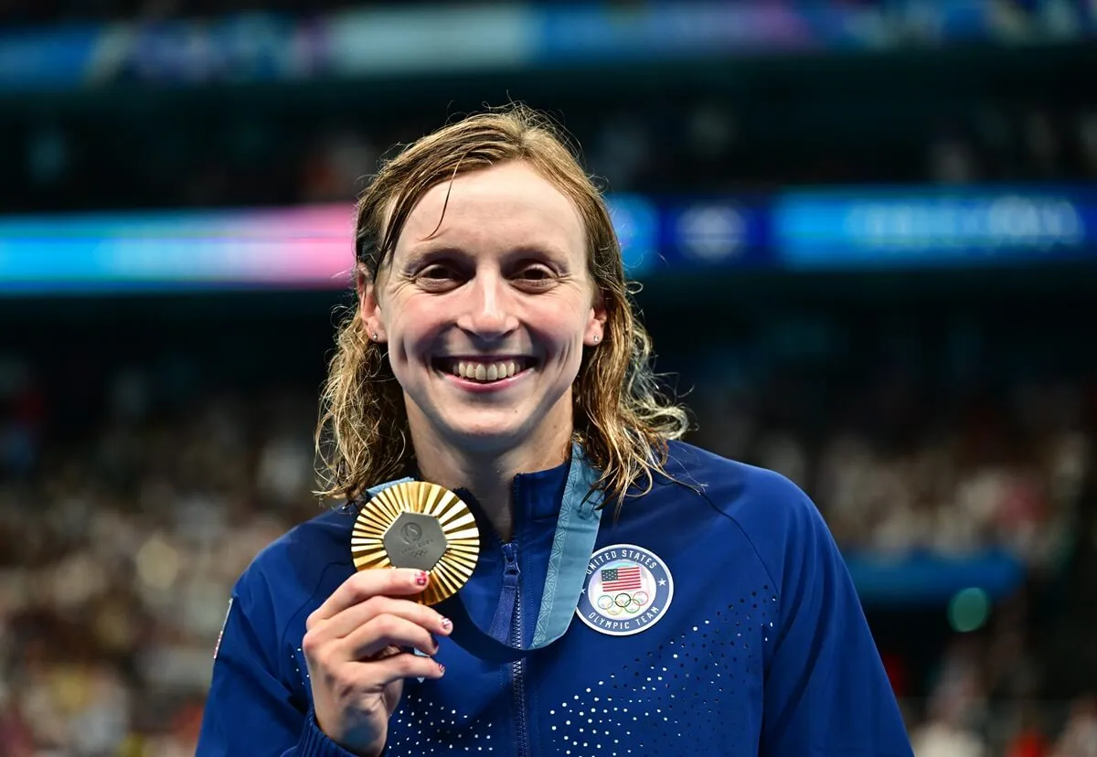 Katie Ledecky with her gold medal after the swimming medal ceremony for the Women's 1500m Freestyle Final